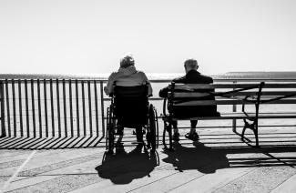 couple sitting on the bench by Bruno Aguirre courtesy of Unsplash.