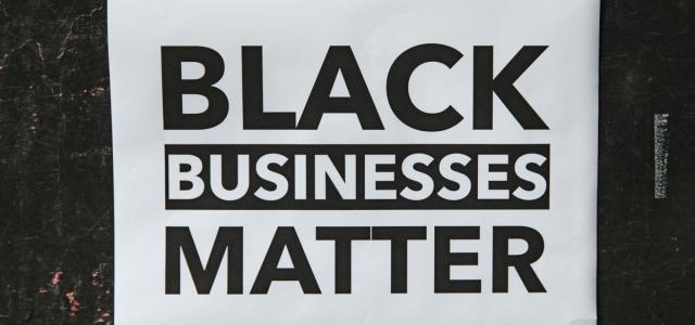 Window sign in a store that reads Black Businesses Matter