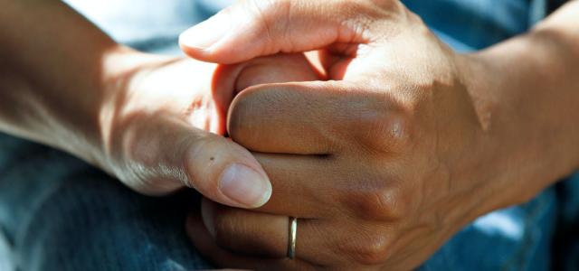 person wearing gold wedding band by National Cancer Institute courtesy of Unsplash.