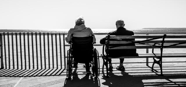 couple sitting on the bench by Bruno Aguirre courtesy of Unsplash.
